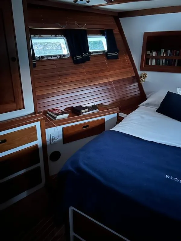 Slide: The Image of Cozy 1999 Lyman-Morse pilothouse cabin with wooden interior and nautical decor. - 55