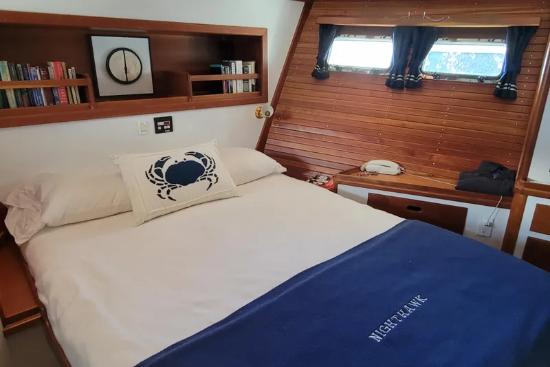 Slide: The Image of Cozy bedroom in 1999 Lyman-Morse pilothouse with nautical decor and wooden accents. - 56