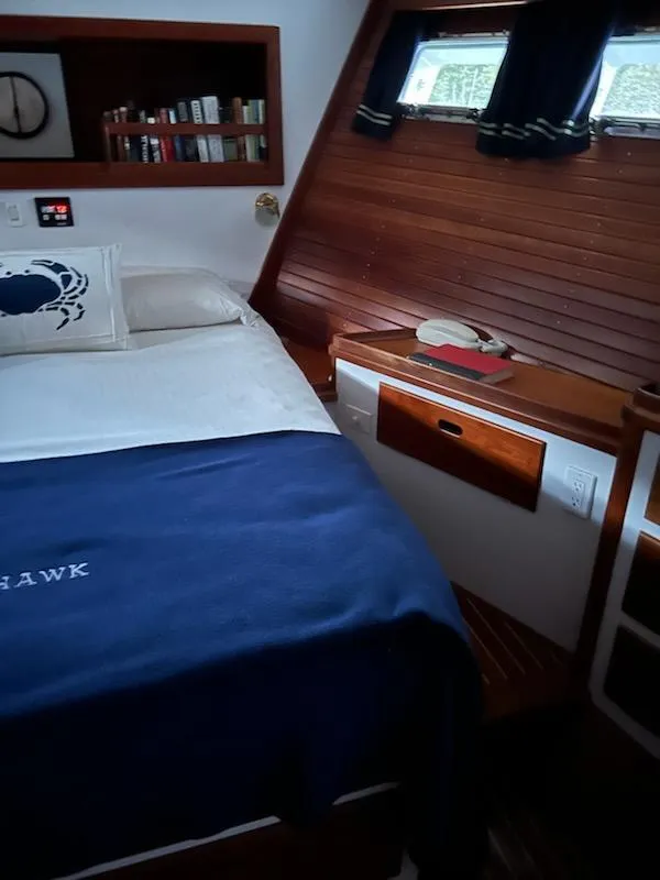 Slide: The Image of Cozy 1999 Lyman-Morse pilothouse bedroom with nautical decor and wooden accents. - 57