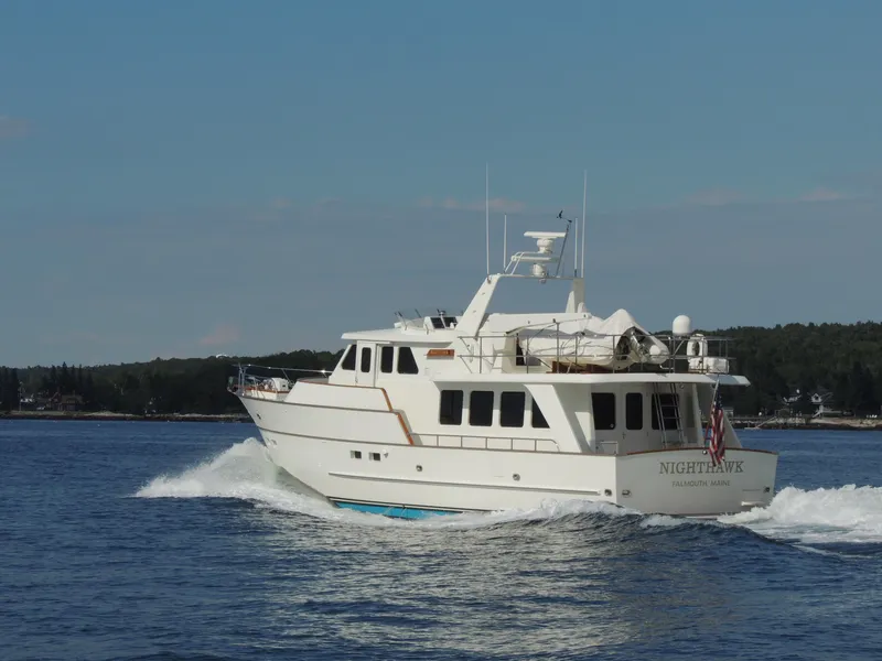 Slide: The Image of 1999 Lyman-Morse pilothouse yacht cruising on open water. - 6