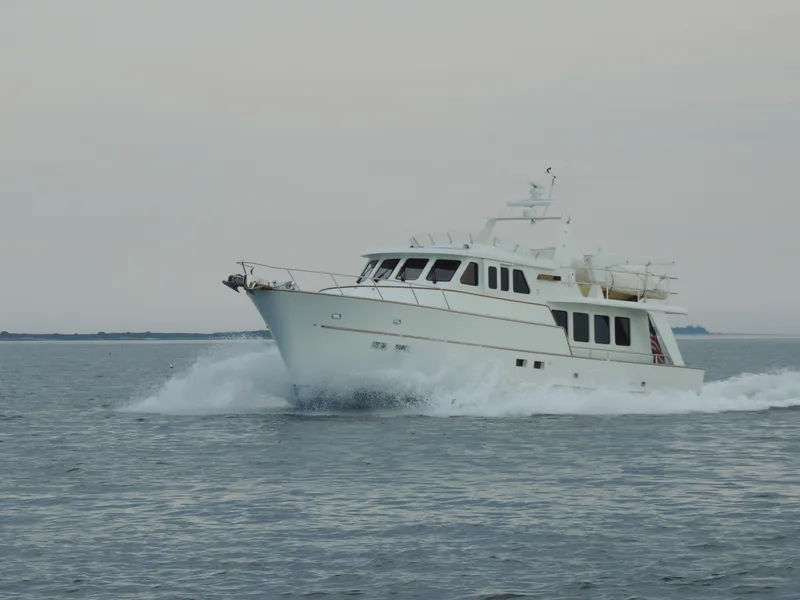 Slide: The Image of 1999 Lyman-Morse pilothouse yacht cruising on open water. - 7