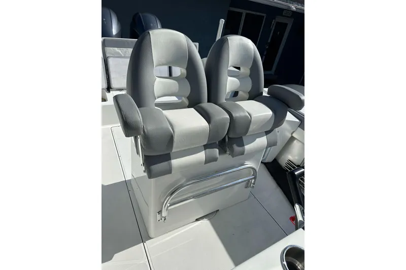 Slide: The Image of Dual gray captain seats on 2019 Release 240 RX boat deck. - 12