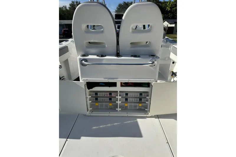 Slide: The Image of 2019 Release 240 RX boat interior with storage compartments and seating. - 13