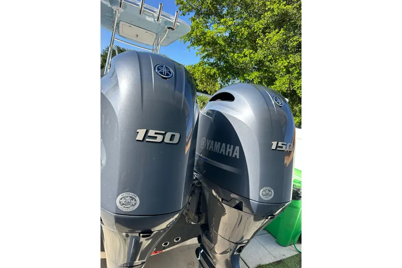 Slide: The Image of Twin Yamaha 150 outboard motors on a 2019 Release 240 RX boat, sunny day. - 20