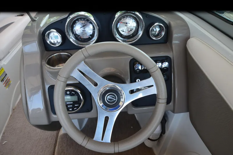 Slide: The Image of Steering wheel and dashboard of 2018 Crownline 205 SS boat. - 12