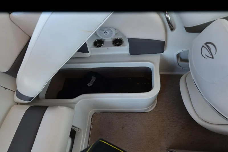 Slide: The Image of Interior of 2018 Crownline 205 SS boat showing storage compartment and seating area. - 19