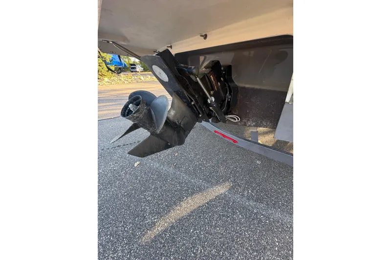 Slide: The Image of 2018 Crownline 205 SS boat propeller and stern drive on pavement. - 25