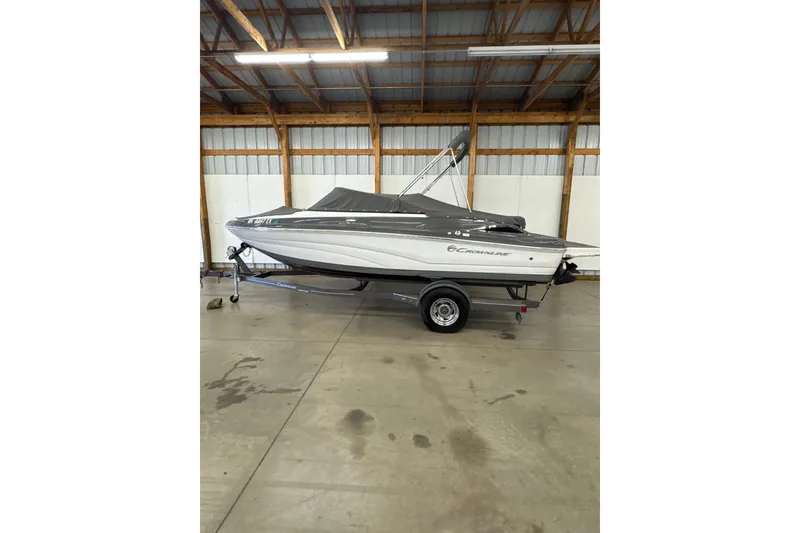 Slide: The Image of 2018 Crownline 205 SS boat on trailer in indoor storage facility. - 28