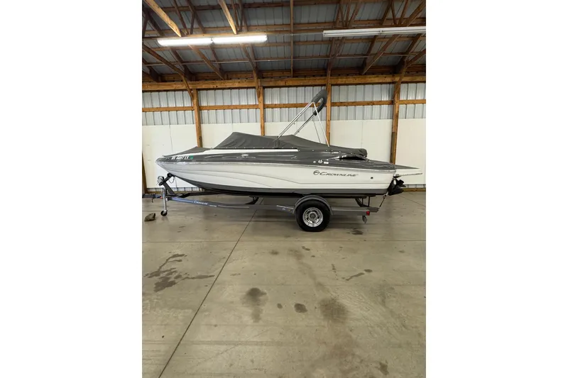 Slide: The Image of 2018 Crownline 205 SS boat on trailer in indoor storage facility. - 29