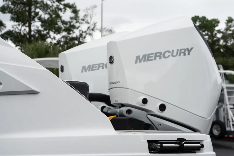 Slide: The Image of 2026 Monterey Elite 30 OB with Mercury outboard engines, close-up view. - 10