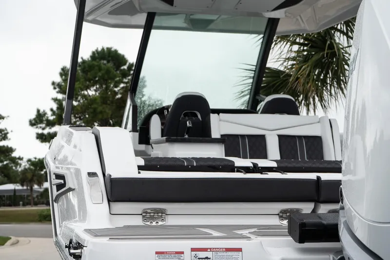 Slide: The Image of 2026 Monterey Elite 30 OB boat with sleek seating and modern design. - 11