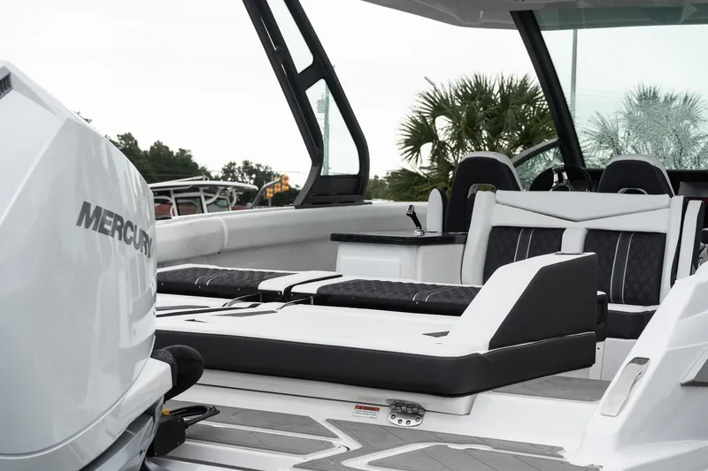 Slide: The Image of 2026 Monterey Elite 30 OB boat interior with Mercury engine, featuring sleek seating and modern design. - 12