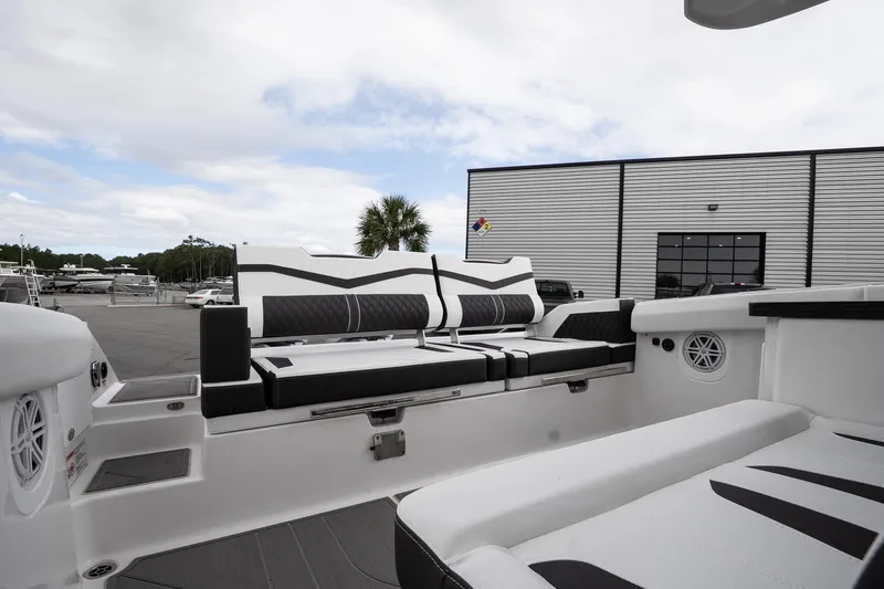 Slide: The Image of 2026 Monterey Elite 30 OB boat interior with sleek seating and modern design. - 17