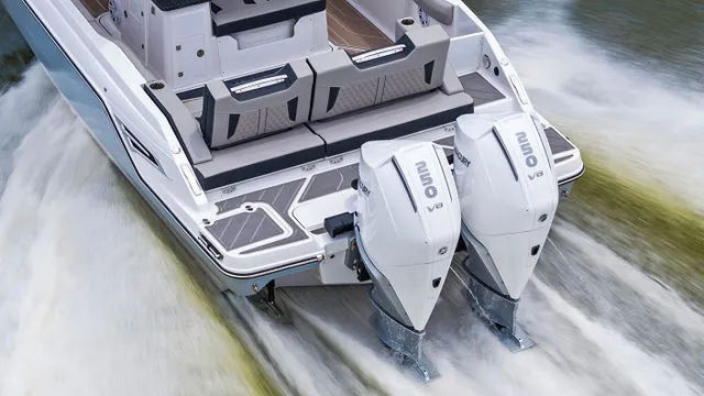 Slide: The Image of Interior view of 2026 Monterey Elite 30 OB boat with modern dashboard and seating. - 34