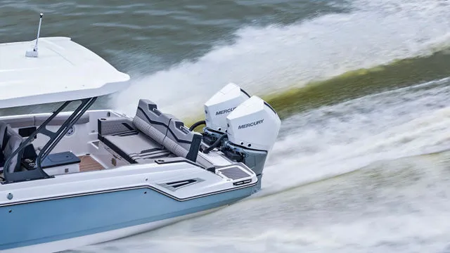 Slide: The Image of Interior view of 2026 Monterey Elite 30 OB boat with modern steering and dashboard. - 36