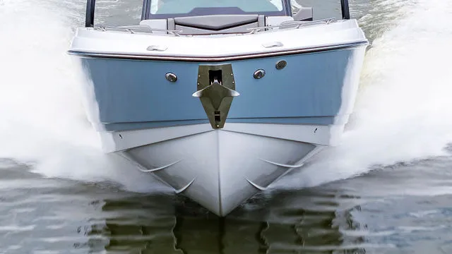 Slide: The Image of Interior of 2026 Monterey Elite 30 OB boat with luxurious seating and steering wheel. - 37