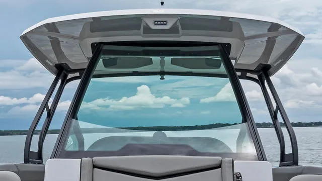 Slide: The Image of 2026 Monterey Elite 30 OB boat interior with cushioned seating and sleek design. - 41