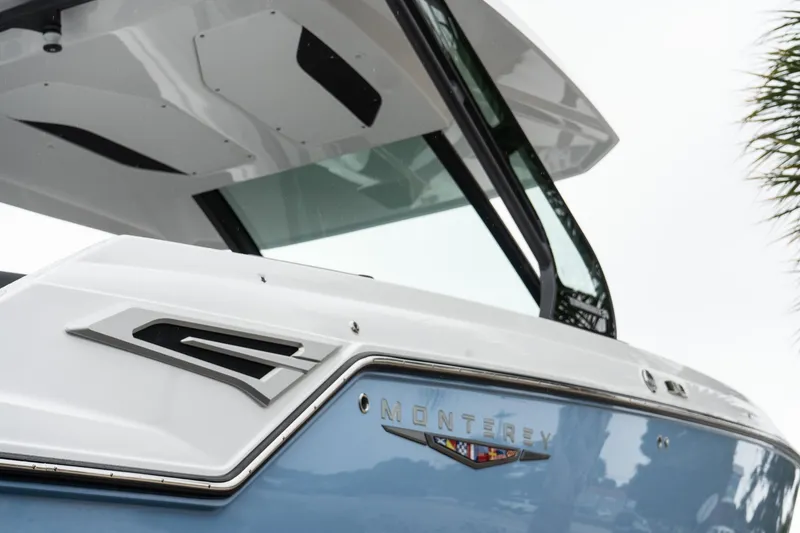 Slide: The Image of 2026 Monterey Elite 30 OB boat with sleek design and modern features. - 8