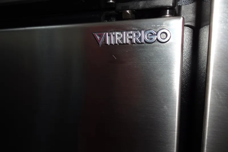 Slide: The Image of Close-up of Vitrifrigo logo on stainless steel appliance, Meridian 459, 2007 model. - 104