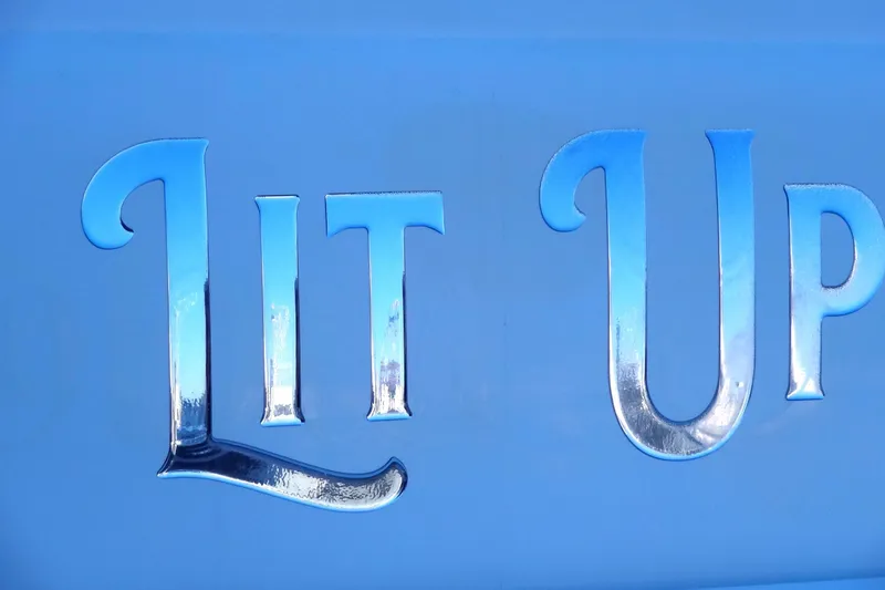 Slide: The Image of "Lit Up" text on blue Meridian 459, 2007 model. - 11