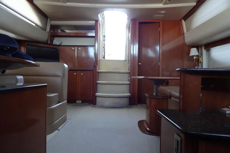 Slide: The Image of Interior of 2007 Meridian 459 yacht with elegant wood finishes and plush seating. - 111