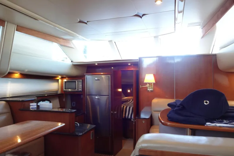 Slide: The Image of Luxurious interior of 2007 Meridian 459 yacht with modern kitchen and cozy seating area. - 116