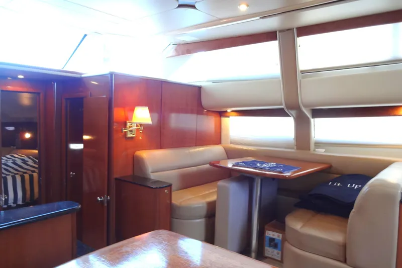 Slide: The Image of Luxurious interior of a 2007 Meridian 459 yacht with elegant seating and wooden finishes. - 117