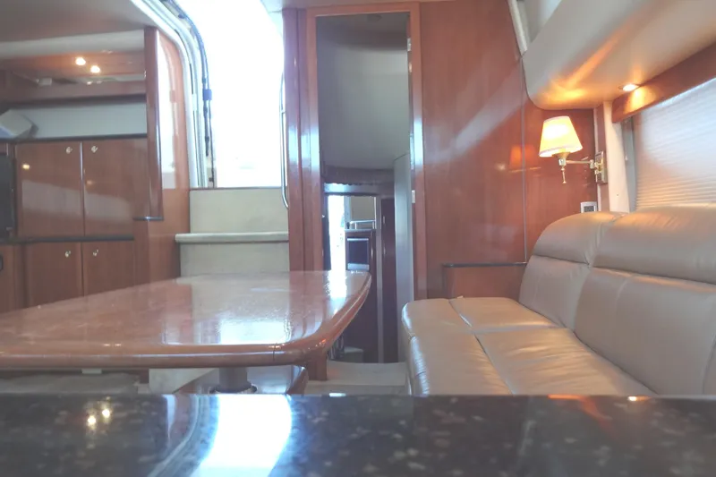 Slide: The Image of Luxurious interior of a 2007 Meridian 459 yacht with elegant wood finishes and comfortable seating. - 118