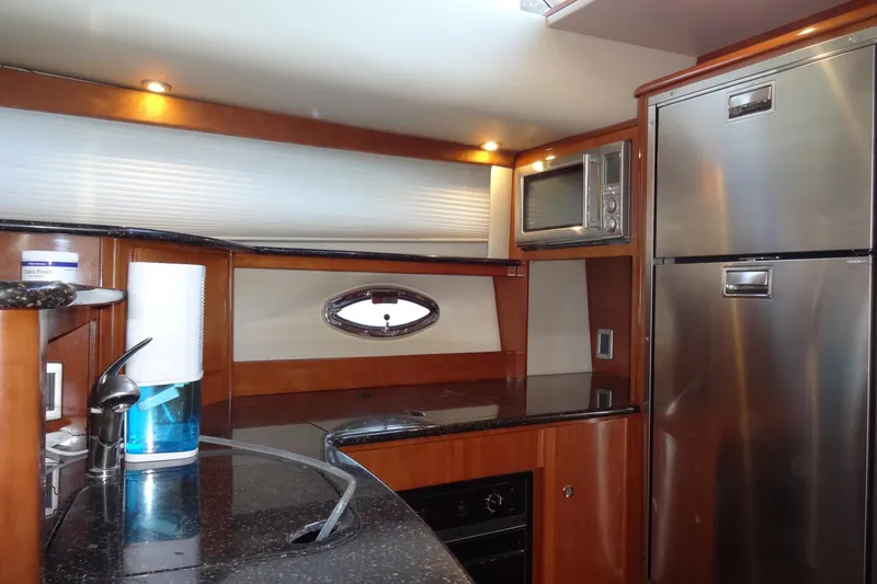 Slide: The Image of Luxurious kitchen interior of 2007 Meridian 459 yacht with modern appliances and sleek design. - 121