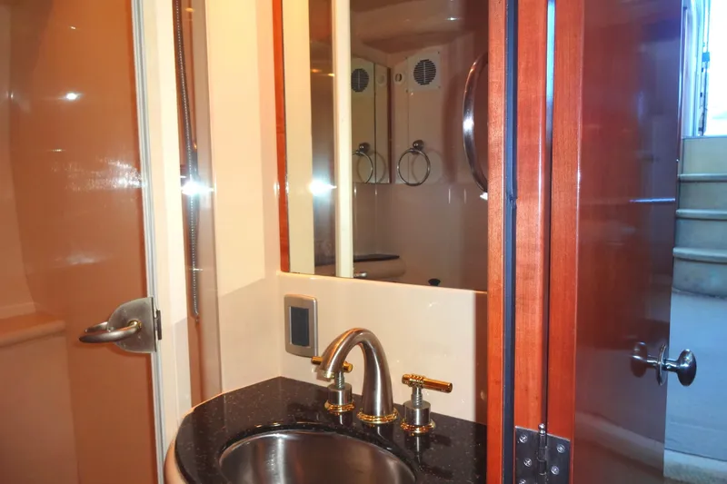 Slide: The Image of Luxurious bathroom interior of 2007 Meridian 459 yacht with elegant fixtures and wooden accents. - 124