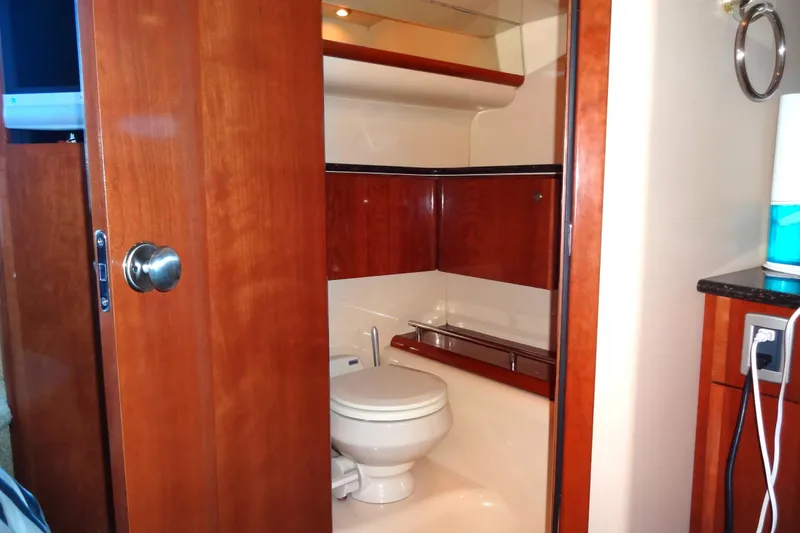 Slide: The Image of 2007 Meridian 459 yacht bathroom with wooden cabinetry and modern fixtures. - 140