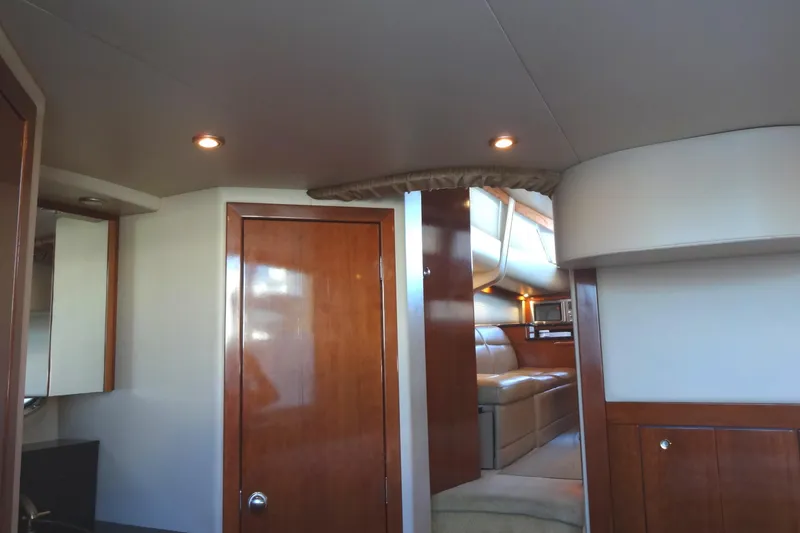 Slide: The Image of Luxurious interior of 2007 Meridian 459 yacht with wood finishes and cozy seating area. - 144