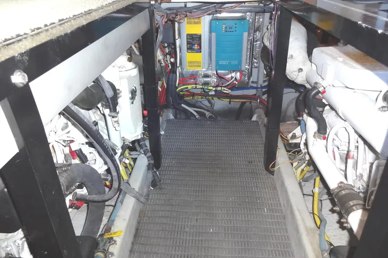 Slide: The Image of Engine room of a 2007 Meridian 459 yacht, showcasing mechanical components and wiring. - 145