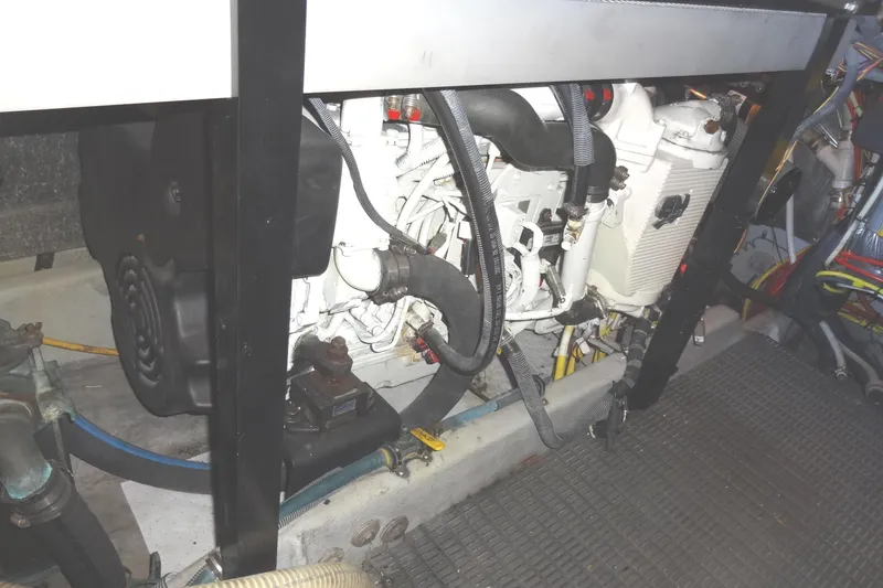 Slide: The Image of Engine compartment of a 2007 Meridian 459 yacht, showcasing mechanical components and wiring. - 148