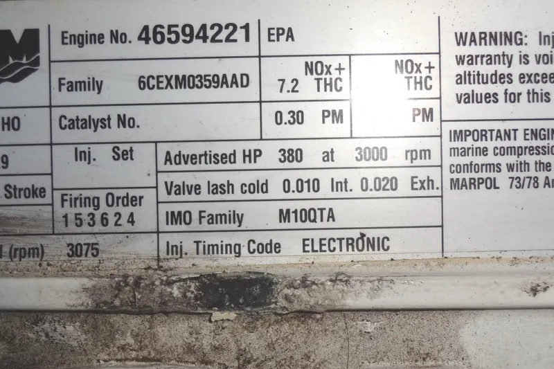 Slide: The Image of 2007 Meridian 459 engine specifications label with firing order and valve lash details. - 151