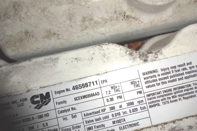 Slide: The Image of Engine label on a 2007 Meridian 459, showing specifications and warnings. - 154