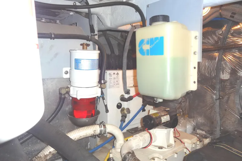 Slide: The Image of Engine compartment of 2007 Meridian 459 yacht with fuel filter and coolant reservoir. - 155