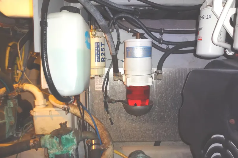 Slide: The Image of Engine compartment of 2007 Meridian 459 yacht showing fuel filter and hoses. - 158