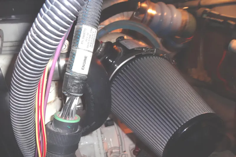 Slide: The Image of Engine compartment of 2007 Meridian 459 with visible wiring and air filter. - 159