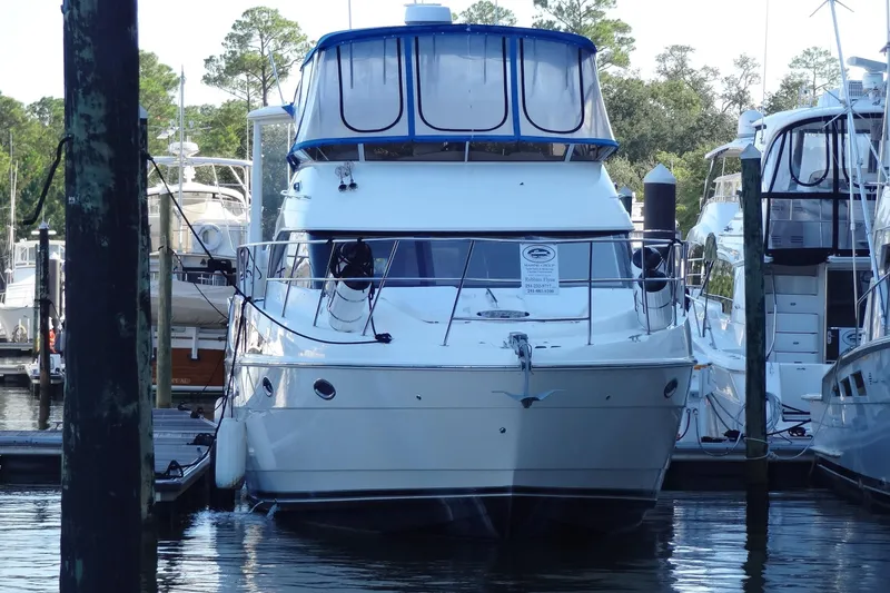 Slide: The Image of 2007 Meridian 459 yacht docked at marina, surrounded by other boats. - 17