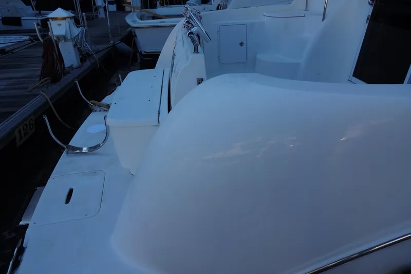 Slide: The Image of 2007 Meridian 459 yacht deck with seating and dock view. - 22