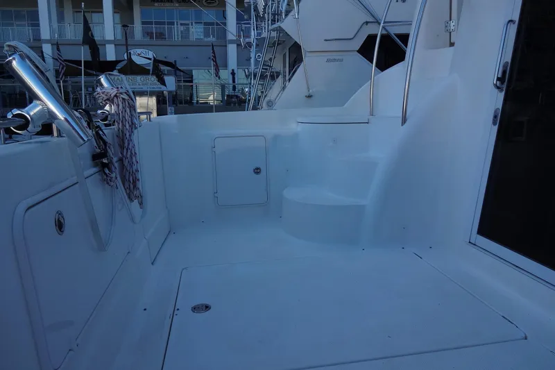 Slide: The Image of 2007 Meridian 459 yacht deck with steps and railing, docked at marina. - 23