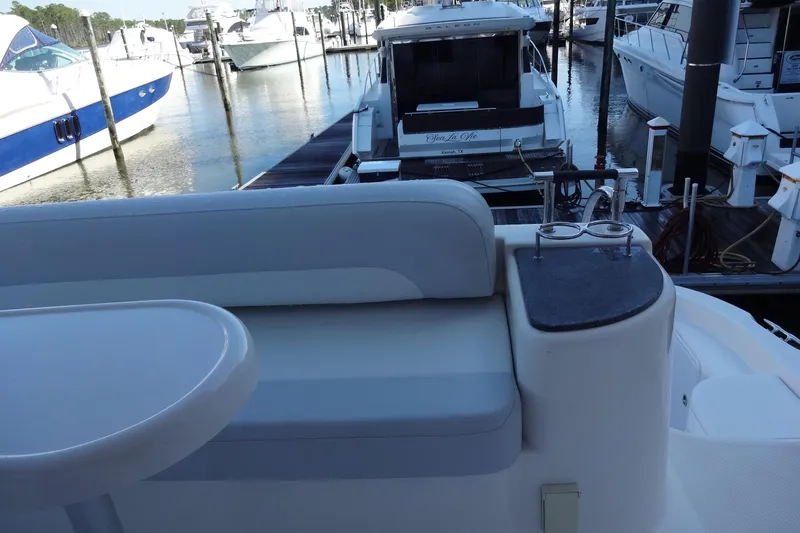 Slide: The Image of 2007 Meridian 459 yacht interior with seating area at marina dock. - 35