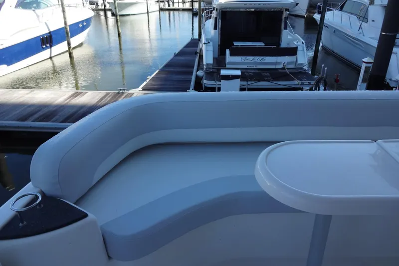 Slide: The Image of 2007 Meridian 459 yacht interior with seating area at marina dock. - 36