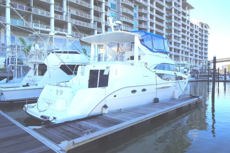 Slide: The Image of 2007 Meridian 459 yacht docked at marina with waterfront buildings in background. - 4