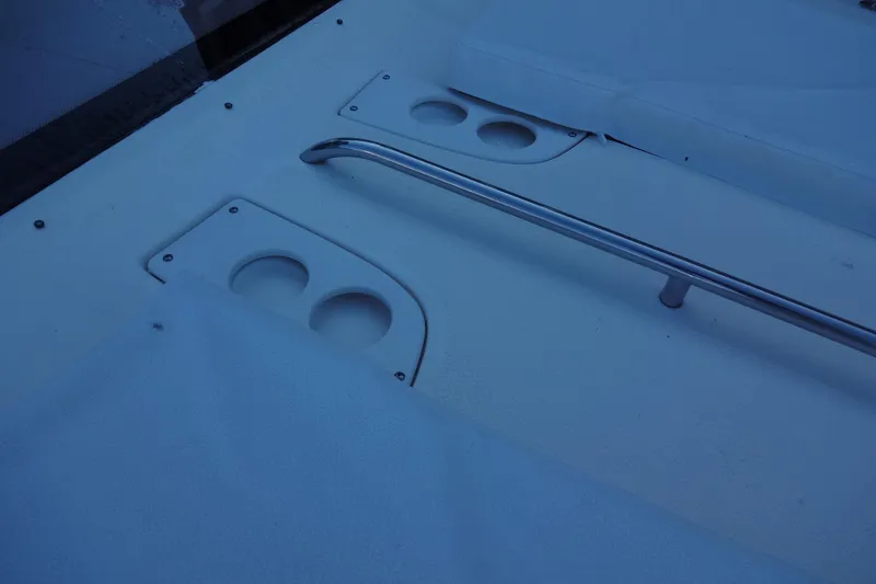 Slide: The Image of 2007 Meridian 459 yacht deck with cup holders and railing. - 49