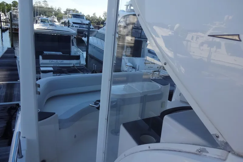 Slide: The Image of 2007 Meridian 459 yacht docked at marina, featuring spacious deck and seating area. - 55