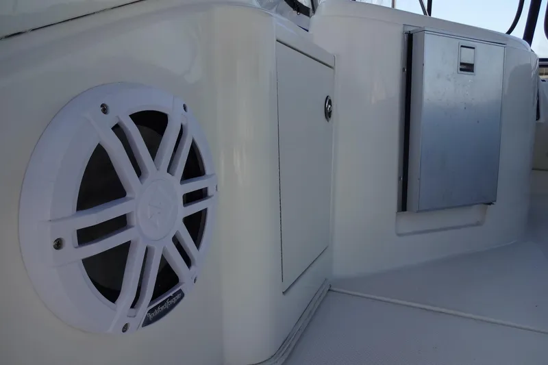 Slide: The Image of 2007 Meridian 459 boat interior with speaker and storage compartments. - 60