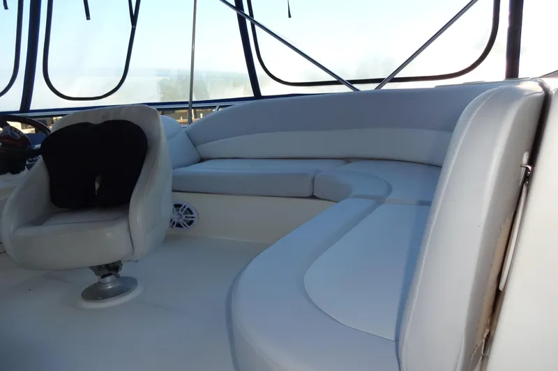 Slide: The Image of 2007 Meridian 459 yacht interior with white seating and helm chair. - 61