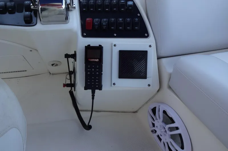 Slide: The Image of Control panel of a 2007 Meridian 459 yacht with Simrad radio and speaker. - 64